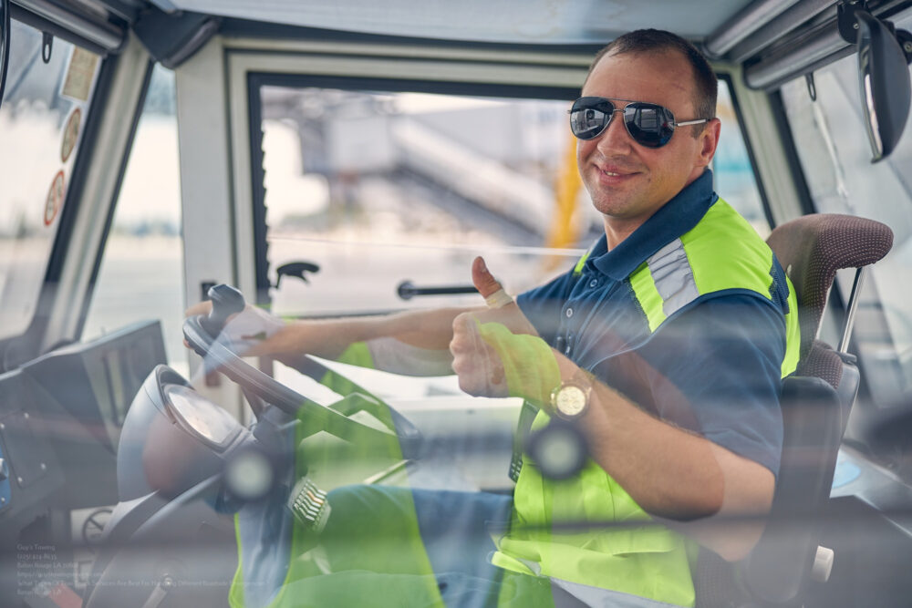 Smiling Man In A Car Posing For The Camera
